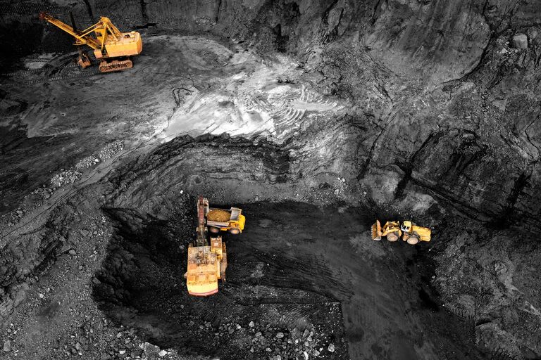 Bagger im Steinbruch, Symbol für Berg- & Tunnelbau